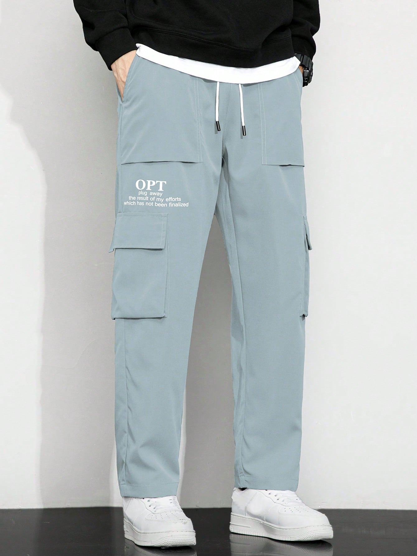 Calça Masculina Cargo Solta Estampa Gráfica E Bolsos Sobrepostos Calça Masculina Cargo Solta Estampa Gráfica E Bolsos