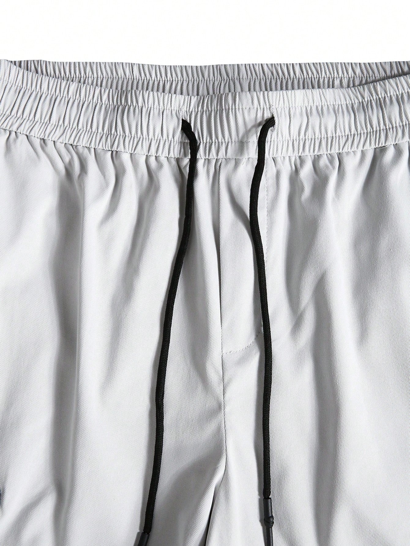 Calça Masculina Cargo Oversized Bolsos Grandes E Punhos Elásticos Calça Masculina Cargo Oversized Bolsos Grandes E