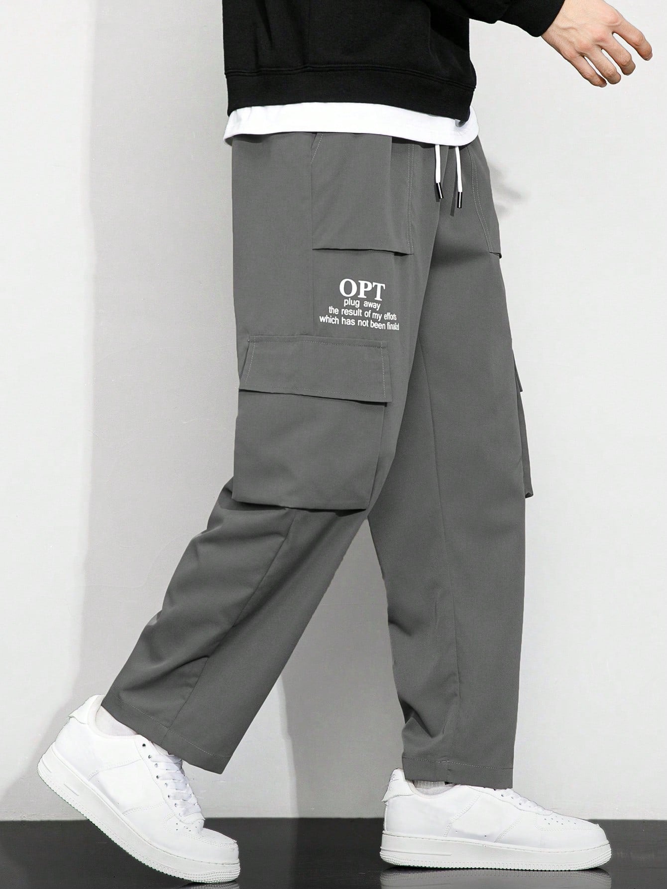 Calça Masculina Cargo Solta Estampa Gráfica E Bolsos Sobrepostos Calça Masculina Cargo Solta Estampa Gráfica E Bolsos