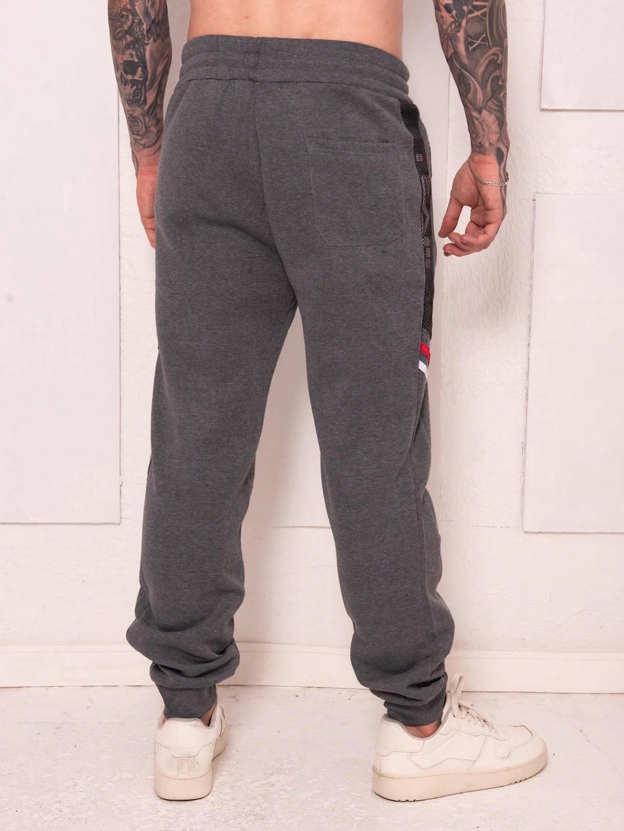 Calça Masculina Jogger Esportiva Com Estampa Team E Zíper Calça Masculina Jogger Esportiva Com Estampa Team E Zíper