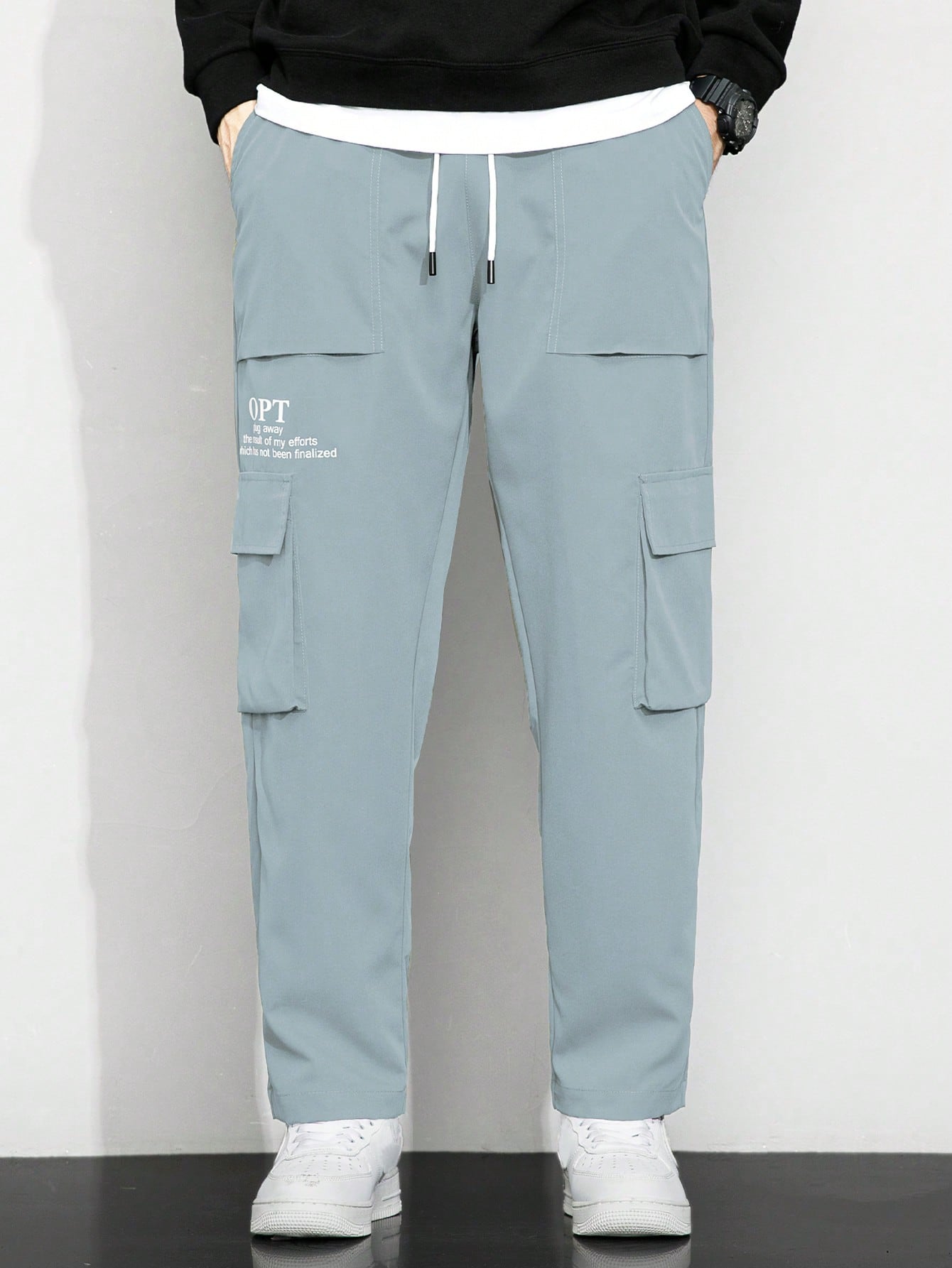 Calça Masculina Cargo Solta Estampa Gráfica E Bolsos Sobrepostos Calça Masculina Cargo Solta Estampa Gráfica E Bolsos